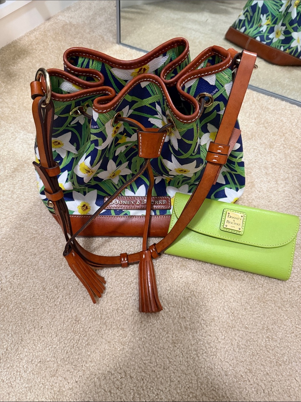 Dooney & Bourke Navy Floral Drawstring Bucket Bag with Brown Leather Trim.